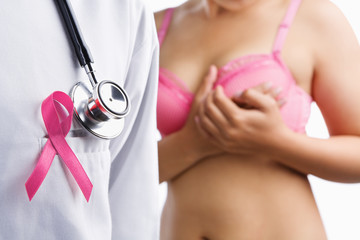Doctor with pink badge and woman on bra - obrazy, fototapety, plakaty