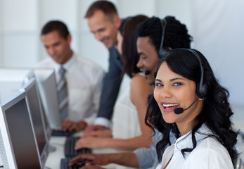 Businesswoman in a call center with her multi-ethnic team