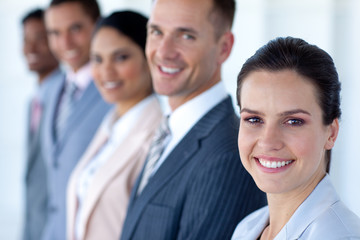 Fototapeta premium Attractive businesswoman with her team in a row