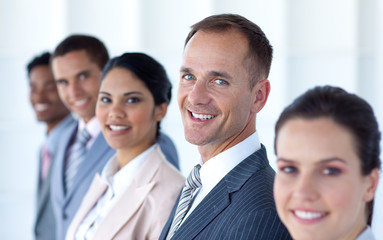 Fototapeta premium Handsome leadership in a row with his team