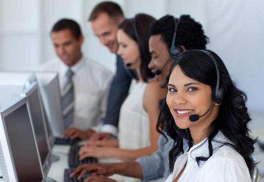Business team working in a call center with a manager - Powered by Adobe