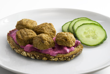 Traditional swedish sandwich with meatballs and beet root salad