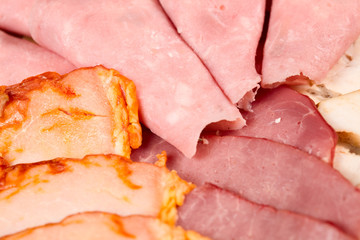 Cutting cured meat on a celebratory table