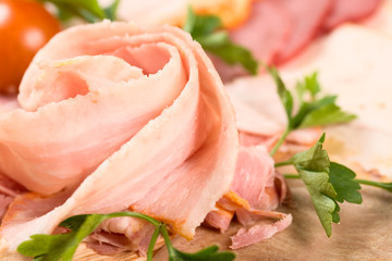Cutting cured meat on a celebratory table