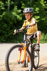 Fototapeta na wymiar Kid riding bicycle