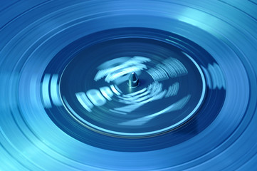 Turning Disc in Blue Light