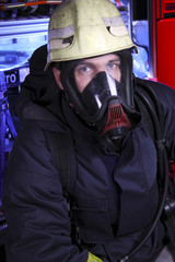 Fototapeta premium Portrait of firefighter in mask