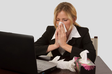 Woman blowing nose