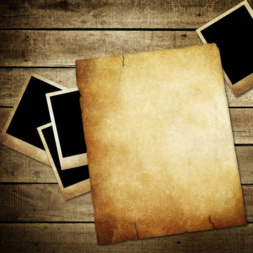 vintage paper and photo on wood background