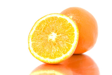 fresh oranges with mirroring  over white background