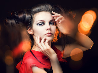 Naklejka premium beautiful girl with a hairdress in the form of horns