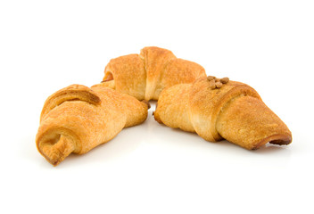 homemade croissants over white background