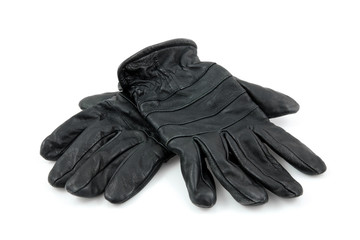 Pair of black leather gloves over white background