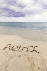 Word 'RELAX' written on the beach of Kandooma