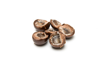Three chocolate balls cut in half