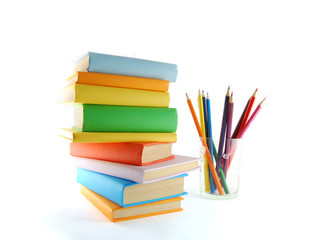 A stack of color books and pencils