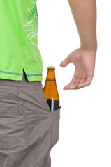 Bottle with a drink lies in a pocket