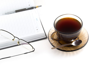 daily planner and cup of coffe