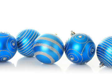 Blue Christmas ornaments, studio isolated.