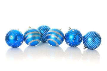 Blue Christmas ornaments, studio isolated.