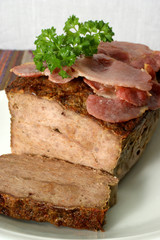 baked meat loaf with organic parsley on a plate