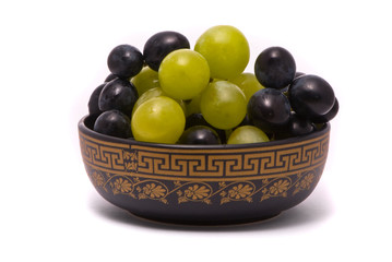 Green and blue grapes on a studio white background