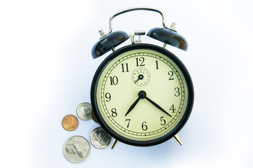 Alarm clock and coins.