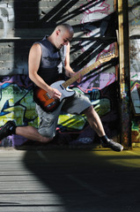 Obraz na płótnie Canvas music guitar player outdoor