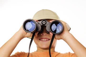 Little boy looking through binoculars