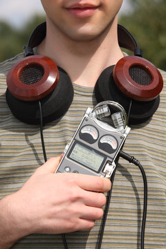Young man with music player and headphones