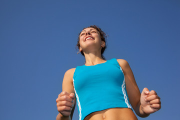 sporty woman runner, view from below