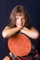 Portrait on a red chair