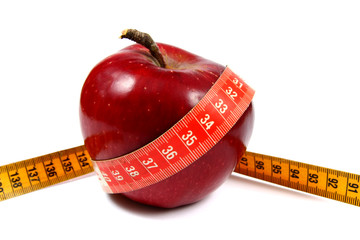 Apple and a measure tape, diet concept