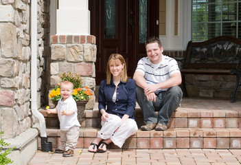 Happy Family of Three Smiling