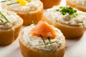Mini sandwiches - bread with cream cheese and salmon
