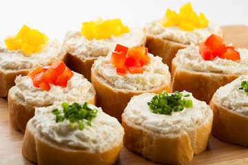 Mini sandwiches - bread with cream cheese and vegetables