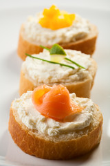 Mini sandwiches - bread with cream cheese and salmon