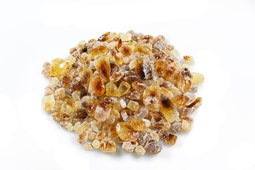 Shining brown candy sugar isolated on white