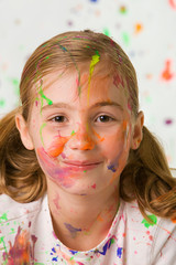 cute girl with messy paint on her face