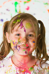Happy, Messy child with paint on her face