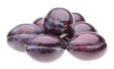 heap plums on white background