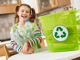 girl recycling plastic bottles