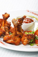 chicken wings with hot spicy barbecue sauce.