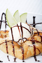 apple  cake and ice-cream on a white plate