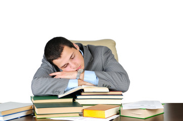 Business man sleeping on book heaps isolated on white