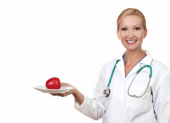 Young female doctor with red an apple