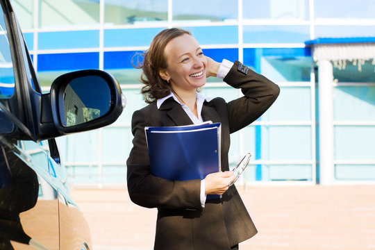 Businesswoman holding a folder.