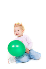 Fototapeta na wymiar cute toddler girl with green balloon over white
