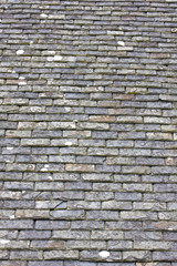a roof in construction with slates