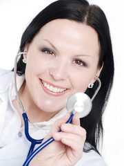 smiling brunette doctor woman holding stethoscope